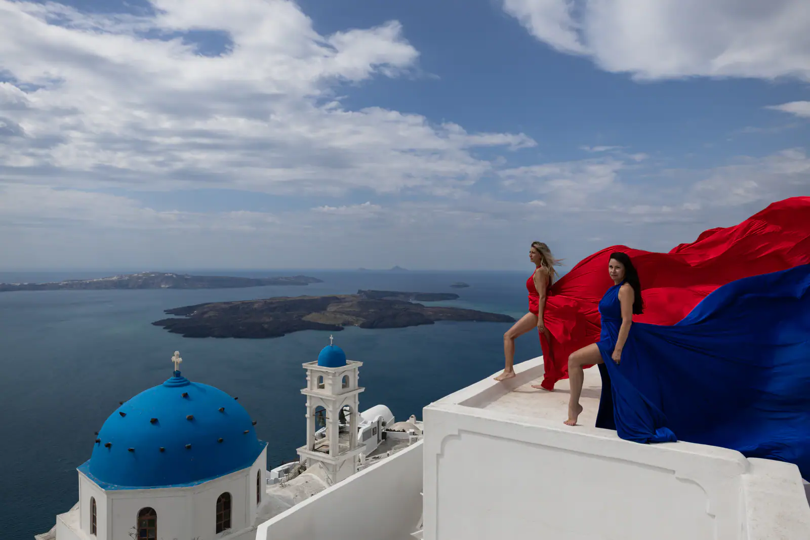 Group flying dress photoshoot in Santorini